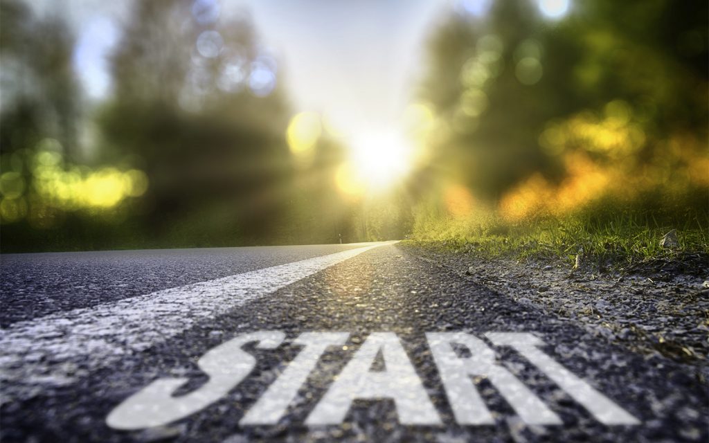 Starting a new trip into a sunny future Street in backlight with bokeh, lensflares and sunbeams